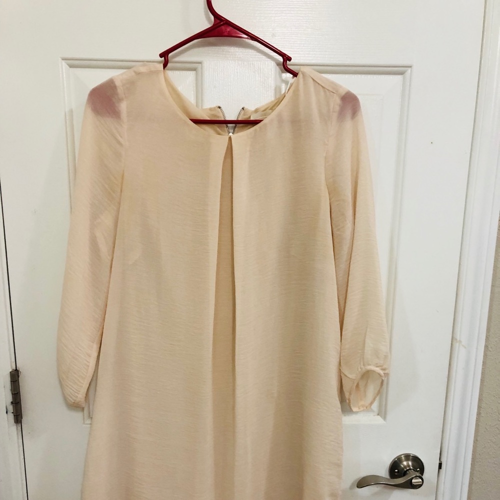 Like new Cream colour one piece knee length dress.